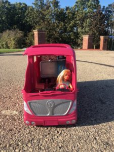 Barbie driving a pink camper from the Barbie Doll Story, Trekking to School.