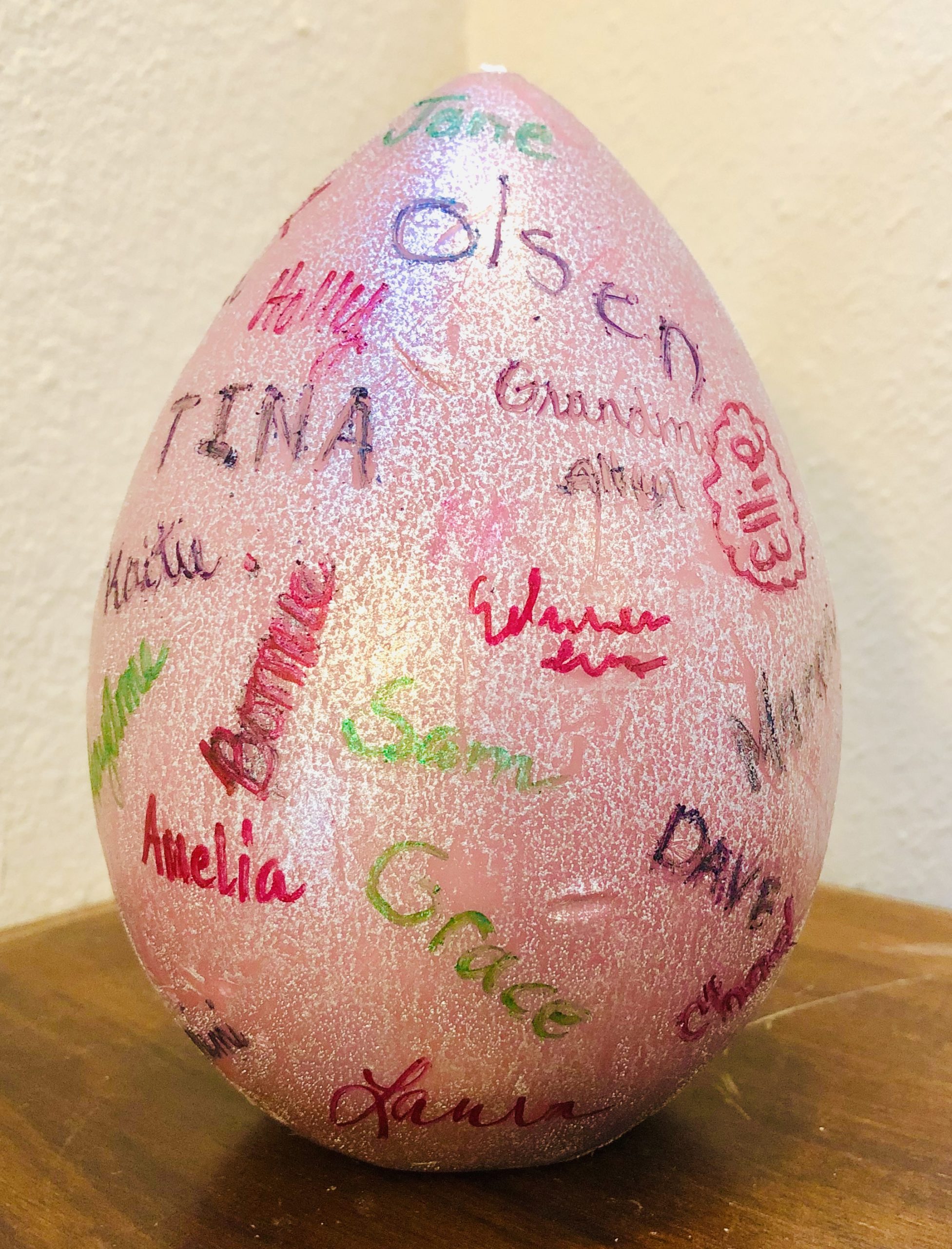The pink, ceramic Easter Egg with family names written on it from a mystery short story for kids called The Case of the Missing Easter Egg