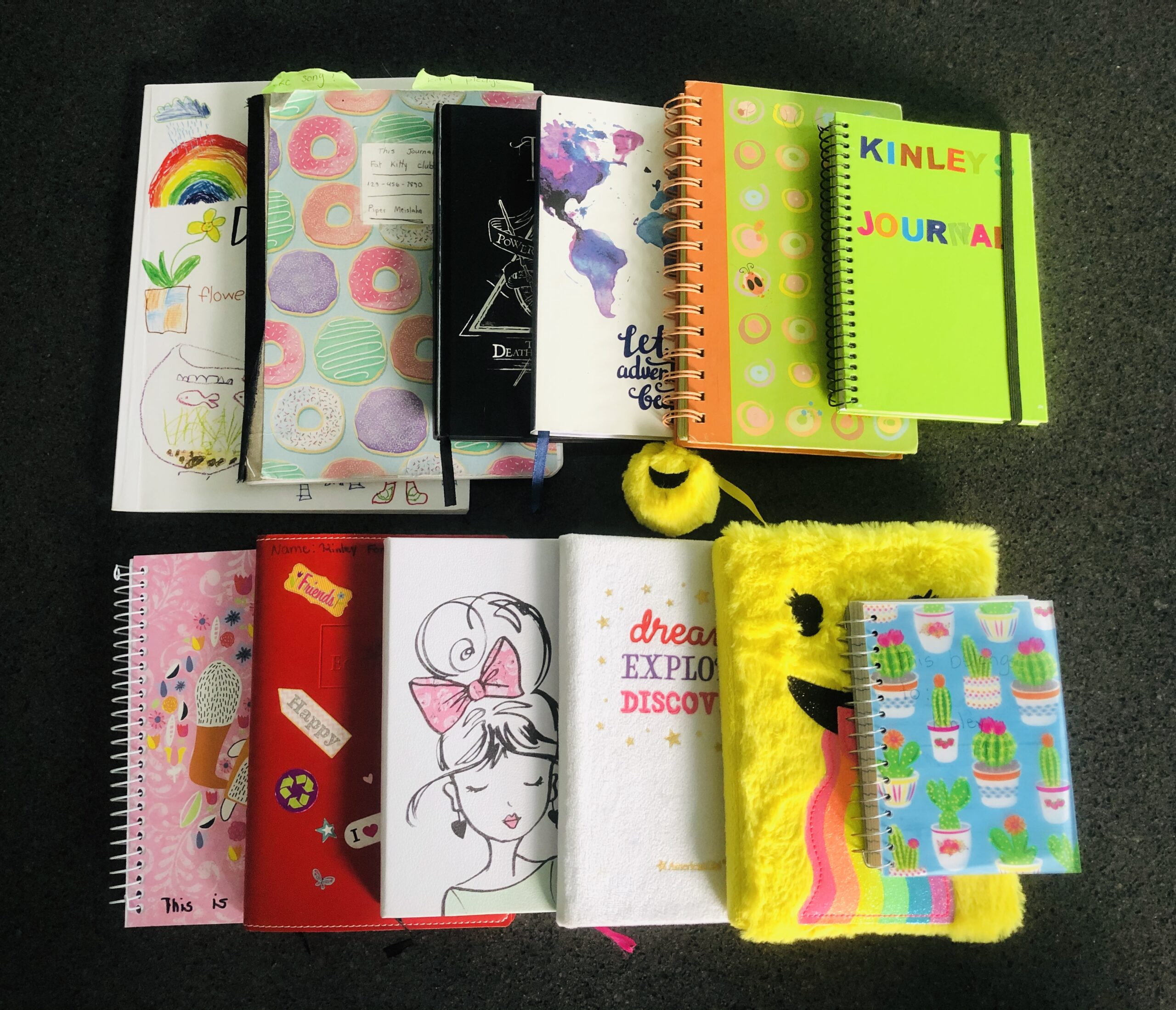 Different colored journals and notebooks for the article 10 Ways to Get kids excited to write.