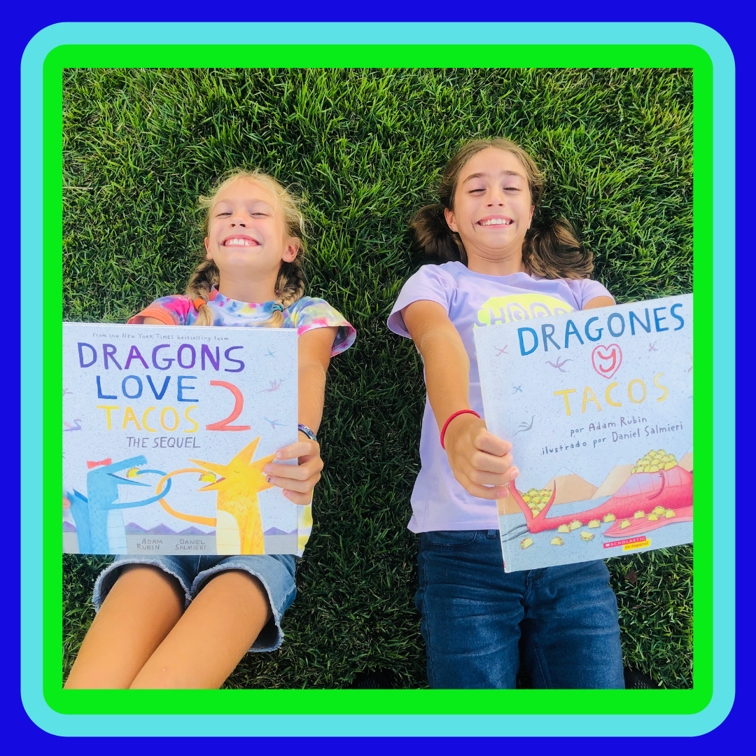 2 girls holding 2 books for the children's book Review on Dragons Loves Tacos. and The Sequel.