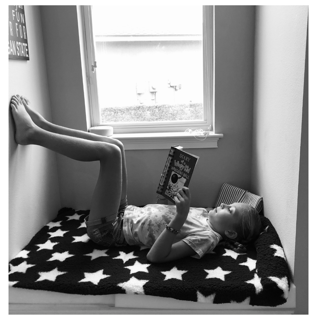 Black and White picture of a child reading