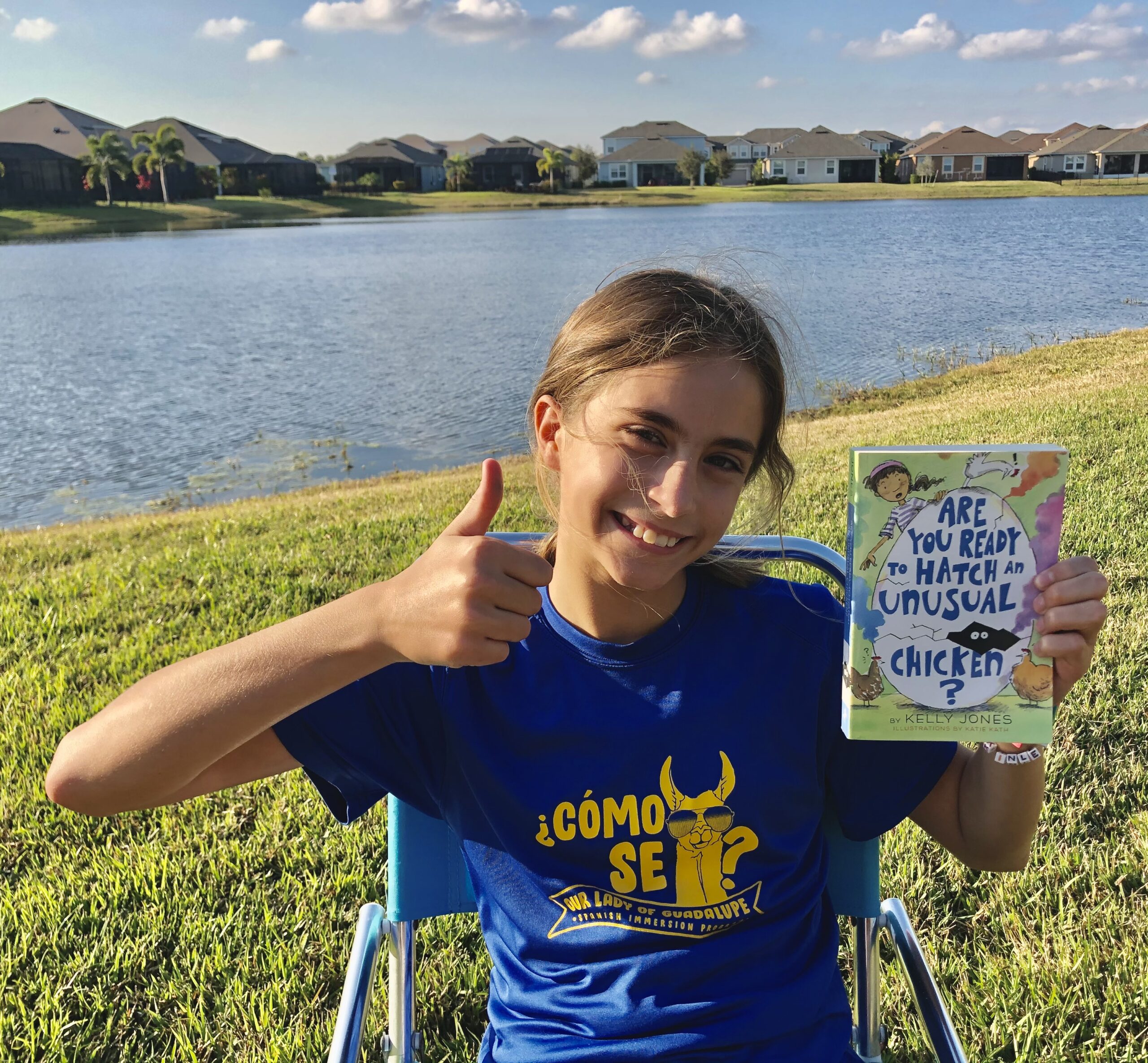 A girl reading a book for the book review on Ae you Ready to Hatch an Unusual Chicken?