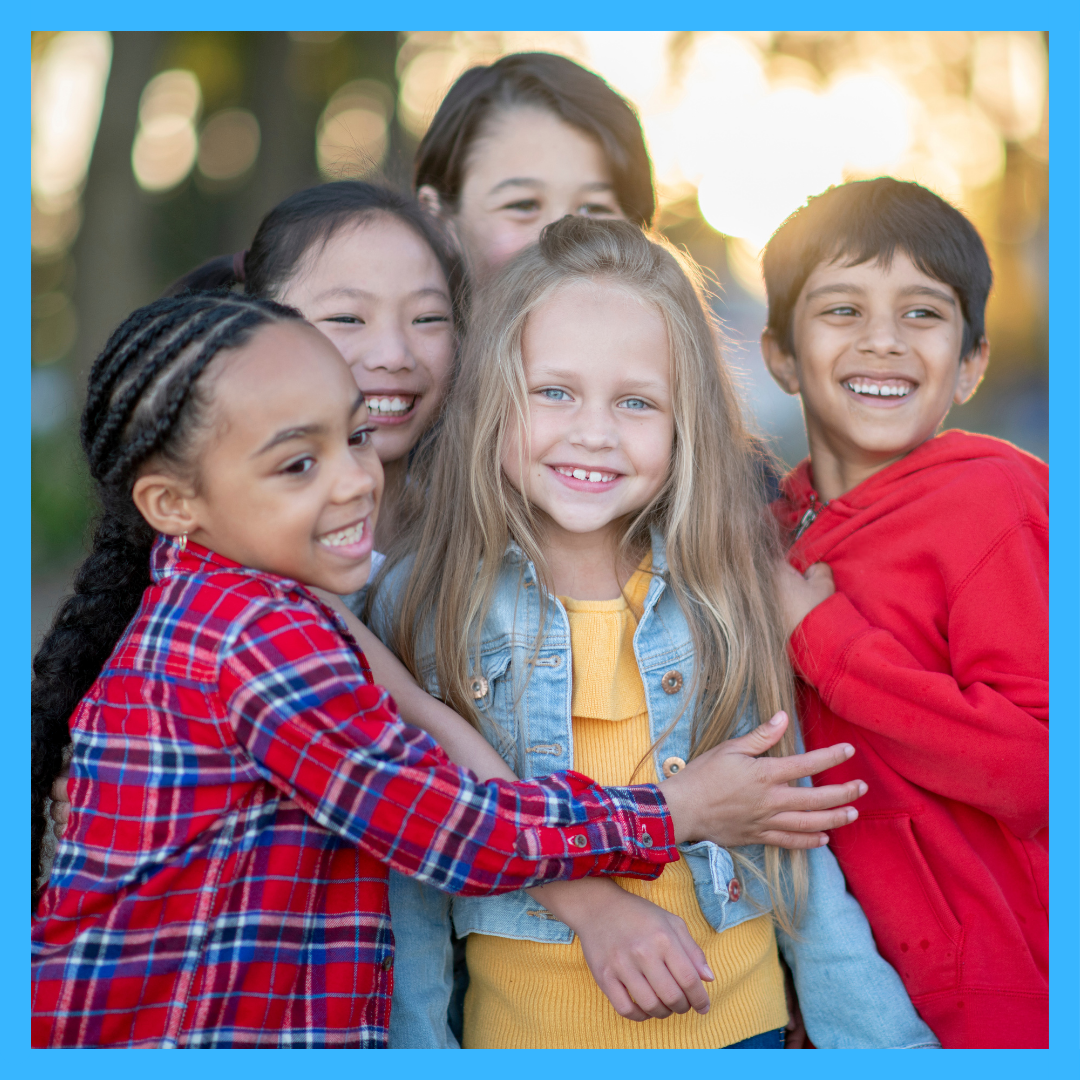 Group of kids hugging/smiling 