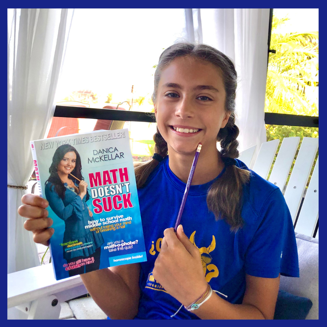 A girl holding up the book, Math Doesn't Suck. Picture for the Middle School Book Review on it.