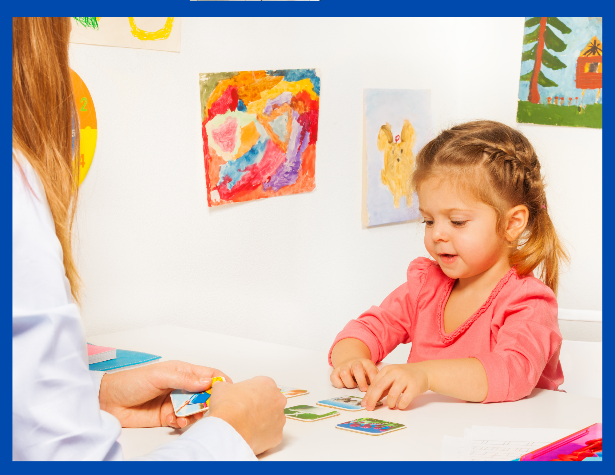 A little girl practicing a literacy skill with vocabulary cards. https://kandblife.com