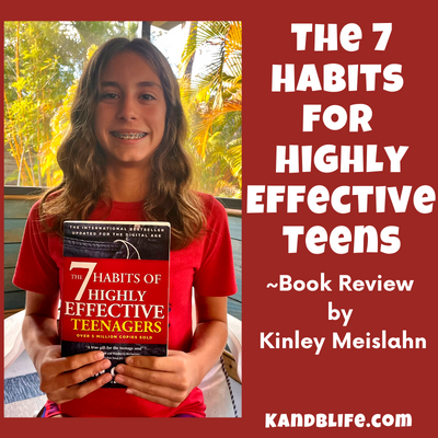 Kinley holding up the book, 7 Habits for Highly Effective Teens